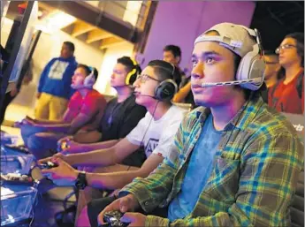  ?? Photograph­s by Barbara Davidson
Los Angeles Times ?? ISAAC “QUIZ” Marquez competes in a “Call of Duty” video game tournament held last month at ESports Arena. The competitio­n business is expected to have $612 million in global revenue this year.