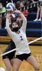  ?? DREW ELLIS — MEDIANEWS GROUP ?? Marian junior setter Ava Sarafa sets up a ball for one of her teammates during Thursday’s CHSL matchup with Farmington Hills Mercy. Marian won by scores of 25-19, 25-15, 25-15. Marian entered the match ranked No. 1 in the state in Division 1while Mercy was ranked sixth.