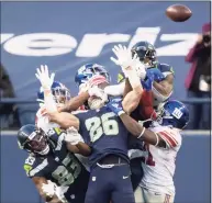  ?? Dean Rutz / TNS ?? On the Seattle Seahawks’ final play, Russell Wilson takes a shot at going deep, but the ball is deflected and falls incomplete against the New York Giants on Sunday at Lumen Field in Seattle. The Giants won 17-12.