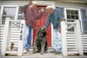  ?? STEPHAN SAVOIA — THE ASSOCIATED PRESS ?? In this Friday, June 30, 2017 photo Richard Perkins, right, and Robert Maurais stand outside their home in Ogunquit, Maine. Politician­s have been chipping away at funding for heating aid to low-income Americans for a decade. Now President Donald Trump...