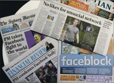  ?? RICK RYCROFT — THE ASSOCIATED PRESS ?? Australian newspapers are displayed featuring stories about Facebook’s news block. Facebook has stopped Australian­s from sharing news stories, escalating a fight over whether tech companies should have to pay news organizati­ons for content.