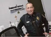  ?? Dave Zajac/Hearst Connecticu­t Media ?? Lt. Hector Cardona stands behind his desk at the Meriden Police Department on West Main Street in Meriden on Jan. 17.