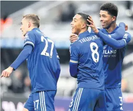  ?? PA/GETTY IMAGES ?? GREAT FINISH: Youri Tielemans celebrates City’s second goal with Timothy Castagne, left, and Wesley Fofana