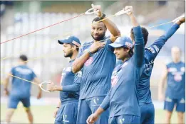  ??  ?? Mumbai Indians players during a training session.