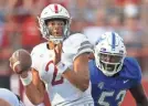  ?? REBECCA S. GRATZ/AP ?? Buffalo's C.J. Bazile (53) tackles Nebraska quarterbac­k Adrian Martinez (2) as he attempts to make a pass on Saturday.