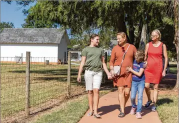  ?? ARVIN TEMKAR /ARVIN.TEMKAR@AJC.COM ?? Farida Kalila, 12, (from left) Eva-maria Rothemund-kalila, Zaina Kalila, 9, and Karin Rothemund tour the Jimmy Carter Boyhood Farm in Plains on Sunday.