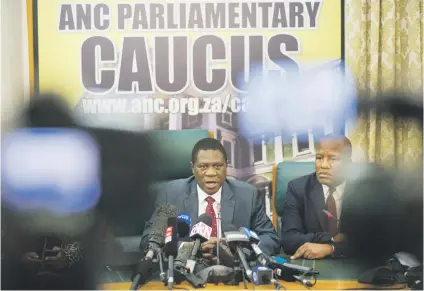  ?? Picture: AFP ?? HE’S GOING. ANC treasurer-general Paul Mashatile, left, and chief whip Jackson Mthembu in Cape Town yesterday during a press conference to discuss President Jacob Zuma’s options.