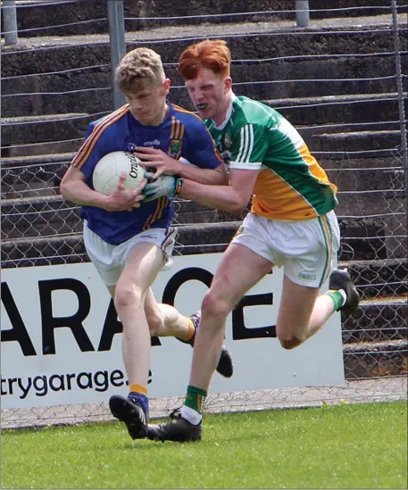  ??  ?? Kevin Quinn of Wicklow is challenged by Harry Balsiger of Offaly.