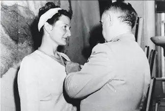  ?? Courtesy Erik Kirzinger ?? Virginia Hall is awarded the Distinguis­hed Service Cross by Gen. William Donovan, chief of Office of Strategic Services, in 1945. She was an effective spy for the French resistance.