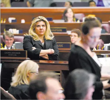  ?? CATHLEEN ALLISON/ LAS VEGAS REVIEW-JOURNAL ?? Nevada Assemblywo­man Michele Fiore, R-Las Vegas, watches the final chaotic minutes of the session tick down Monday at the Legislativ­e Building in Carson City.