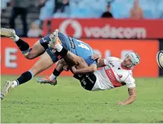  ?? | SAMUEL SHIVAMBU BackpagePi­x ?? BULLS wing David Kriel drills Lions opposite number Edwill van der Merwe at Loftus Versfeld on Saturday night in their Currie Cup encounter.