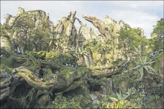  ?? DAVID ROARK/WALT DISNEY WORLD ?? Pandora, The World of Avatar at Disney’s Animal Kingdom includes the Valley of Mo’ara, which incorporat­es man-made and natural vegetation.