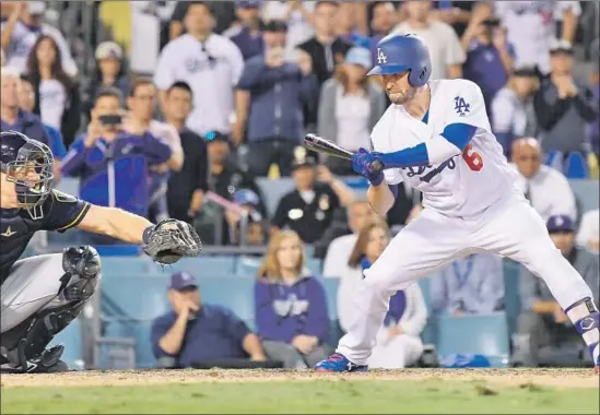  ?? Wally Skalij Los Angeles Times ?? BRIAN DOZIER watches strike three as a pinch-hitter with the bases loaded to end Game 3 of the NLCS at Dodger Stadium, a 4-0 Milwaukee victory.