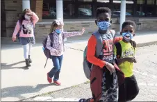  ?? Ned Gerard / Hearst Connecticu­t Media ?? Students leave Sunnyside Elementary School in Shelton at the end of the school day on Wednesday.