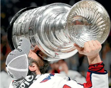  ?? AP ?? Washington Capitals captain Alex Ovechkin kisses the Stanley Cup after his side beat the Vegas Golden Knights 4-3 in game five to seal the series yesterday.