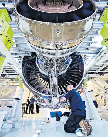  ??  ?? A Rolls-royce engine being built. The company is investing heavily in engine production as it tries to double its output