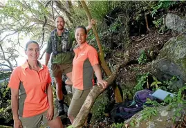  ??  ?? Department of Conservati­on biodiversi­ty supervisor Jo Mendonca, left, fishery ranger Tim Maule and community ranger Candace Graham recently visited Motutaiko to check on pest traps and the state of local fisheries.