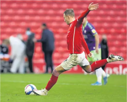  ?? Picture: George Wood/Getty ?? Cauley Woodrow scores the penalty which earned Barnsley a point against Bristol City