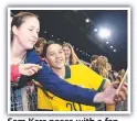  ?? ?? Sam Kerr poses with a fan.