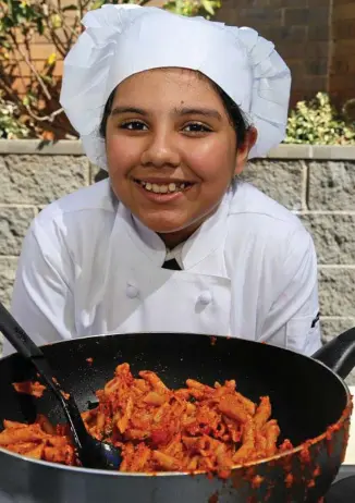  ??  ?? COOKING UP A STORM: Radhapriya Bhardwaj taught her fellow Year 6 Fairholme College students about cooking yesterday.