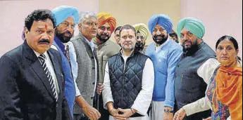  ?? PTI ?? Congress vicepresid­ent Rahul Gandhi being greeted by a party delegation from Punjab, after he filed his nomination papers for the post of party president, at the AICC office in New Delhi on Monday.