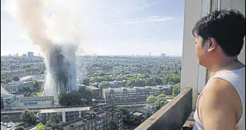  ?? AP ?? Smoke billows from the 24storey Grenfell Tower in London that was engulfed by fire on Wednesday.