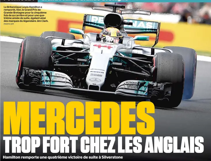  ?? PHOTO AFP ?? Le Britanniqu­e Lewis Hamilton a remporté, hier, le Grand Prix de Grande-Bretagne pour la cinquième fois de sa carrière et pour une quatrième année de suite, égalant ainsi des marques du légendaire Jim Clark.