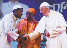  ?? Vincenzo Pinto / AFP / Getty Images ?? Pope Francis greets a Rohingya refugee in Dhaka. He apologized for the “indifferen­ce of the world . ... Your tragedy has a place in our hearts,” he said.