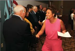  ?? The Sentinel-Record/Richard Rasmussen ?? 2017-18 SCHOLARS: Jessica Dobyns, right, was congratula­ted by Dennis Smith, chairman of the Oaklawn Foundation board of directors, and scholarshi­p committee members Tuesday after she was presented a $3,000 scholarshi­p for the 2017-18 academic year. The...