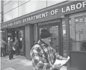  ?? JOHN MINCHILLO/AP ?? Visitors to the Department of Labor are turned away because of closures over coronaviru­s concerns in New York City.