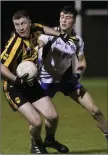  ??  ?? Avoca’s Brian Canavan tries to hold off AGB’s Jack Furlong.