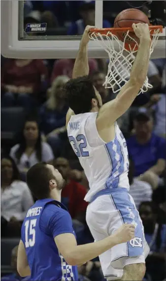  ?? MARK HUMPHREY — THE ASSOCIATED PRESS ?? North Carolina forward Luke Maye (32), pictured dunking the ball on Kentucky forward Isaac Humphries (15), is a key glue guy for the Tar Heels.