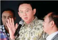  ??  ?? Ahok speaks to the media following a meeting at the Attorney-General's Office in Jakarta to discuss the blasphemy case yesterday.