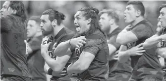  ?? DARRYL DYCK, THE CANADIAN PRESS ?? Maori All Blacks’ Marcel Renata, centre, and his teammates perform a traditiona­l war cry called a “haka” before playing Canada in a rugby match in Vancouver Friday evening.
