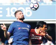  ?? AP ?? Chelsea’s Olivier Giroud (left) scores his side’s opening goal during the English Premier League match against Liverpool at Stamford Bridge stadium in London yesterday.