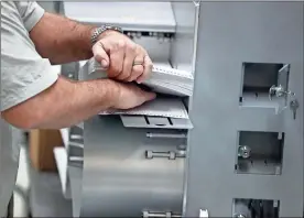  ?? / AP-Brynn Anderson ?? A worker loads ballots into machines at the Broward County Supervisor of Elections office during a recount in Lauderhill, Fla., on Sunday.