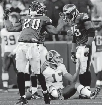  ?? NICK WASS/AP PHOTO ?? Philadelph­ia safety Brian Dawkins celebrates his tackle of Washington quarterbac­k Jason Campbell during the fourth quarter of a Dec. 10, 2006 game in Landover, Md. Dawkins will be inducted into the Hall of Fame during tonight’s ceremonies in Canton, Ohio.