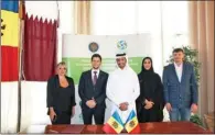  ??  ?? Moldova Embassy Charge d’affaires Mihai Clapaniuc with EPR Chairman Abdulla Ibrahim al Suwaidi and others at an agreement signing event.
