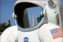  ?? ALEX WONG/GETTY IMAGES ?? A replica of a spacesuit is on display during the Apollo 50 Festival at the National Mall in July.