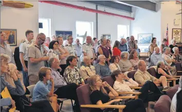  ?? CHRIS SAULNIER ?? Family, friends and co-workers filled the room at the Greenwood Military Aviation Museum to see a stamp unveiled in Capt. Mary Cameron-kelly’s honour.