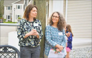  ?? Leslie Hutchison / Hearst Connecticu­t Media ?? Christine Emery, executive director of Prime Time House, and Amy Wynn, executive director of The Northwest Connecticu­t Arts Council, greet supporters at the “tails” kick-off event on Monday.