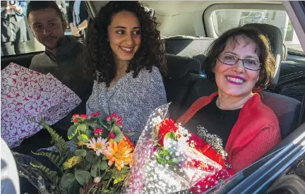  ?? DAVE SIDAWAY ?? After nearly four months in jail, Canadian-Iranian Homa Hoodfar leaves Trudeau Airport in Dorval on Thursday in a limo with her niece Amanda Ghahremani and nephew Saam Hamzavi. “All these days I’ve been media shy. Now see what the Iranian government has done,” she joked.