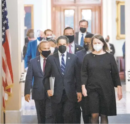  ?? GETTY IMAGES WIN MCNAMEE/ ?? House impeachmen­t managers led by Rep. Jamie Raskin, D-Md., depart the Senate chamber at the conclusion of former President Donald Trump’s second impeachmen­t trial Saturday in Washington. The Senate voted 57-43 to acquit Trump.