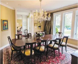  ??  ?? When redesignin­g the kitchen, Joan decided to incorporat­e the existing windows into the dining-area cabinetry. The feature lets in more light and uses sunlight as a natural highlight for the couple’s crystal collection.