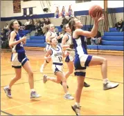  ?? Photo by Bob Parana ?? Kane's Hailey Sheaffer scores during her JV team's 48-21 win in Johnsonbur­g on Friday. Shaffer scored six in the contest.