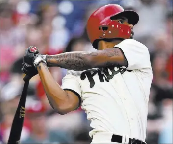  ?? Derik Hamilton The Associated Press ?? Phillies pinch hitter Nick Williams follows through on a go-ahead home run in the eighth inning of Philadelph­ia’s 2-1 home win over the Blue Jays on Saturday.