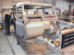  ??  ?? Land Rover Defenders are imported from Great Britain, stripped down to the frame and rebuilt to modern and highly customized specificat­ions. Fabricator George Hausner is working on body panels that might need significan­t repair or complete replacemen­t.
