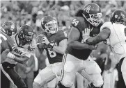  ??  ?? OU quarterbac­k Baker Mayfield sees Dede Westbrook open for a touchdown pass during a 41-3 win against Akron on Sept. 5, 2015, in Norman. [OKLAHOMAN ARCHIVES]