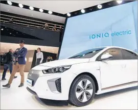  ?? Martial Trezzini EPA ?? THE HYUNDAI IONIQ electric vehicle is displayed in March at the Geneva auto show in Switzerlan­d. A hybrid version will hit California dealership­s this year.
