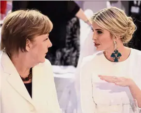  ?? — AP ?? Strengthen­ing ties: Ivanka speaking with Merkel at a dinner on the sidelines of the W20 Summit in Berlin.